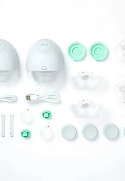 Inhoud Elvie Pump verpakking met borstschilden en flesjes